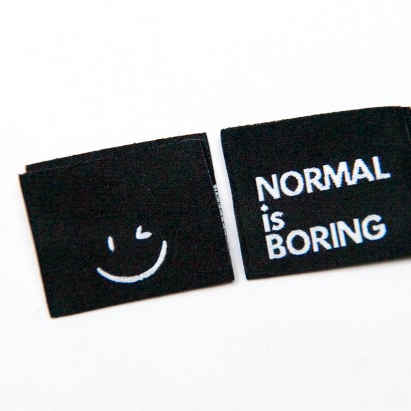 Normal is boring zwart